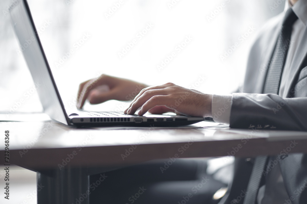 close up.businessman typing text on laptop. people and technology close up.businessman typing text on laptop. people and technology