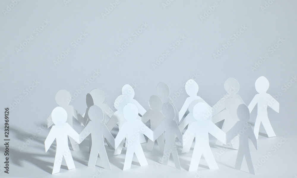 concept of teamwork.team paper men standing. photo with copy space. concept of teamwork.team paper men standing. photo with copy space.