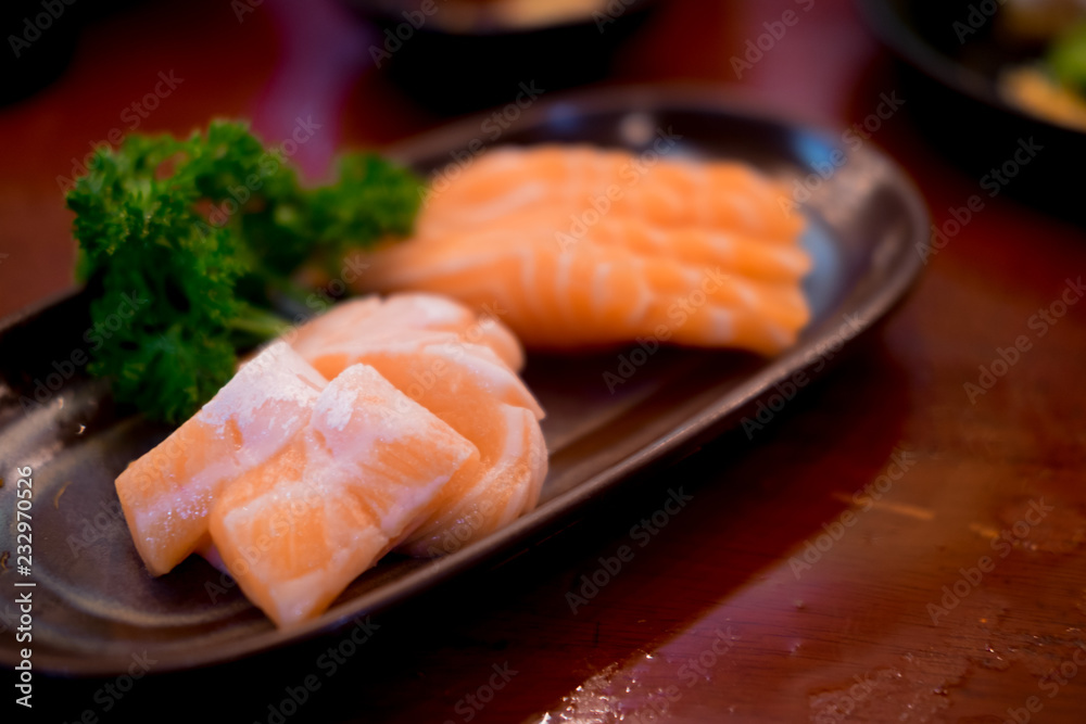 Raw salmons fillet on dish in restaurant