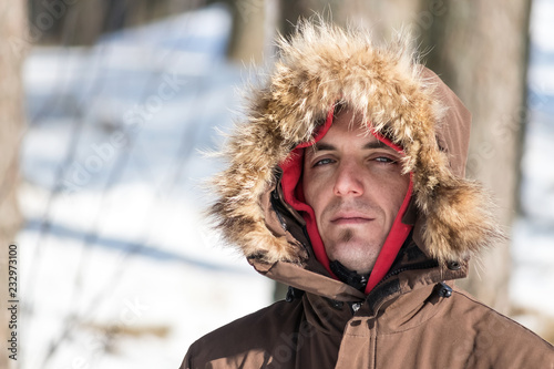 Man with fur hood in the winter