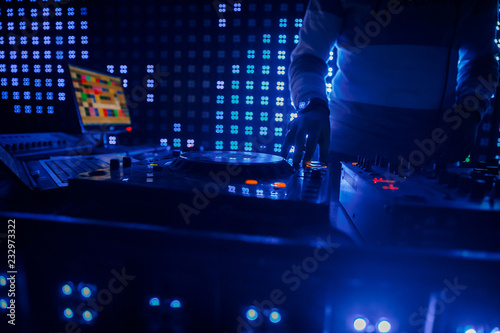 Deejay at the Party.hand of the DJ operator.DJ playing music at mixer closeup