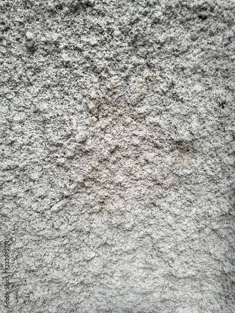 Gray plaster coat on the wall as a background