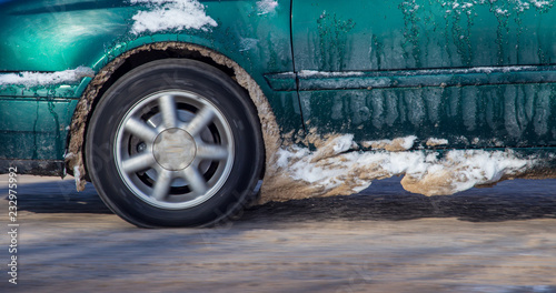 Car wheel in the snow in winter