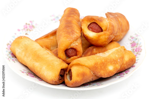 Sausage dough in a plate on a white background
