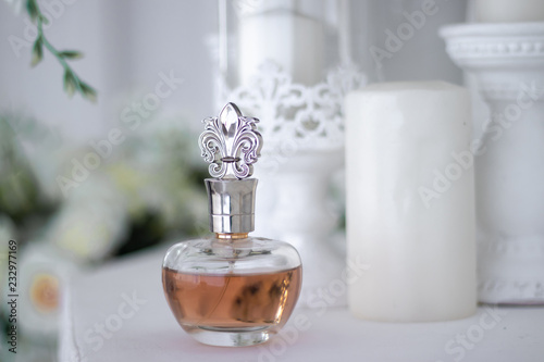 Beautiful perfume bottle Aroma of women's perfume. Caramel colored