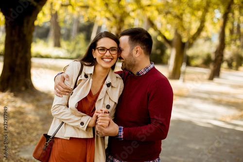 Young woman and man walking...