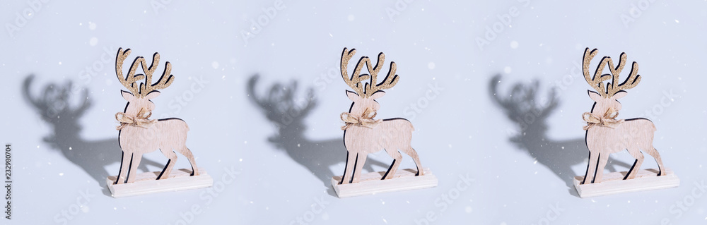 Cute reindeer chrismas decoration on bright background.