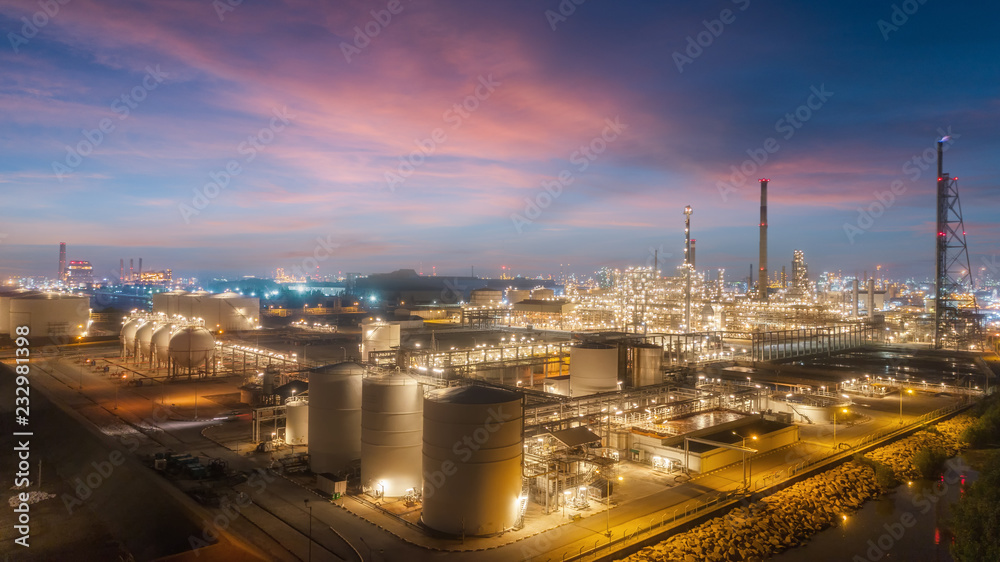 Oil refinery factory with beautiful sky at dusk for energy or gas industry or transportation background.