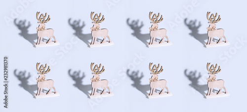 Cute reindeer chrismas decoration on bright background. © Olga