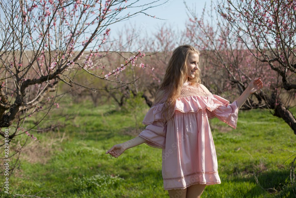 beautiful blonde woman in a flowered rose garden beautiful blonde woman in a flowered rose garden