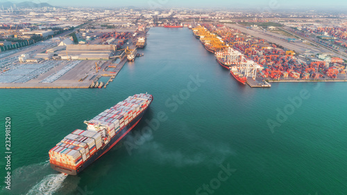 Aerial view container ship to sea port and working crane bridge loading container for logistics import  export or transportation concept background.