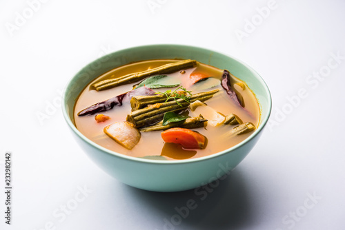 Drumstick Curry or Shevga sheng bhaji or south indian Sambar, served in a bowl over moody background. Selective focus photo