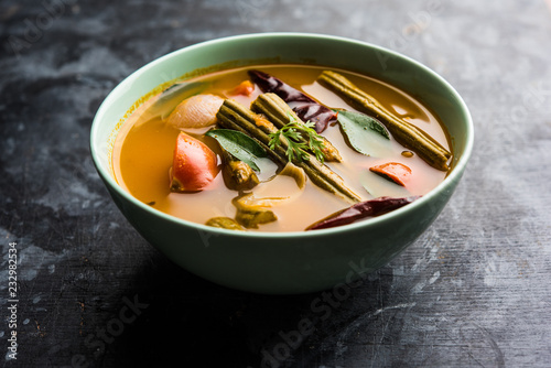 Drumstick Curry or Shevga sheng bhaji or south indian Sambar, served in a bowl over moody background. Selective focus photo