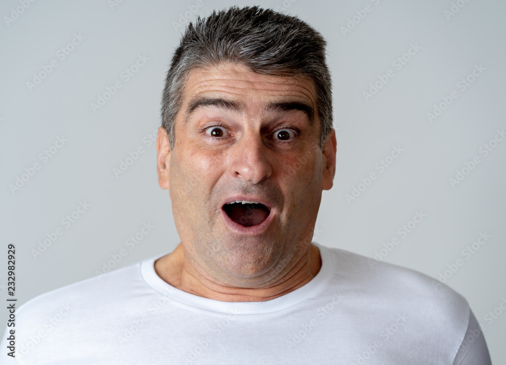 Close up portrait of surprised and happy man celebrating victory and wining lottery Close up portrait of surprised and happy man celebrating victory and wining lottery