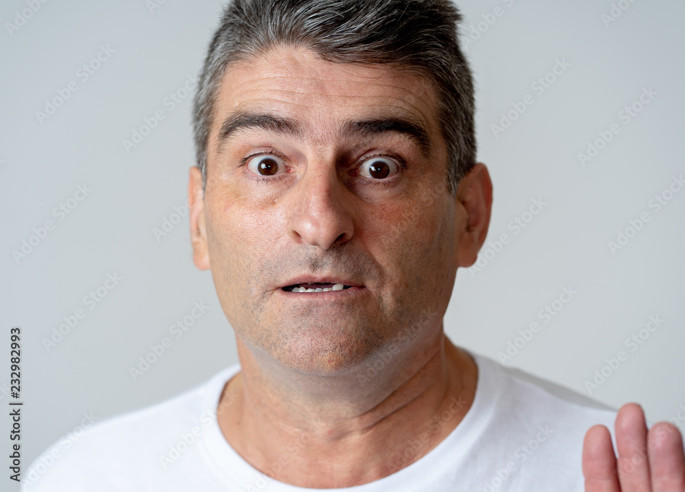 Obraz premium Concern scared shocked adult man with a terrified facial expression