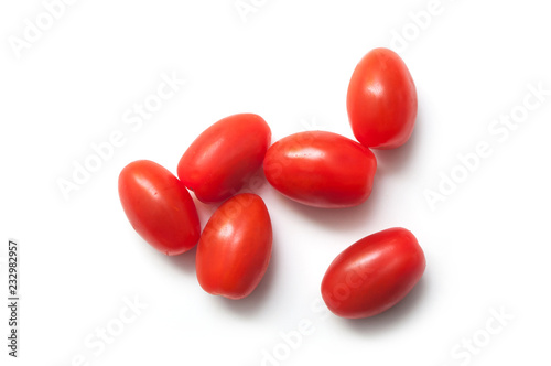 Photography closeup of mini organic tomatoes roma on white background