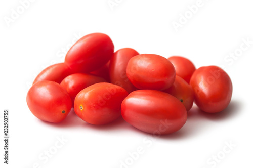 closeup of mini organic tomatoes roma on white background