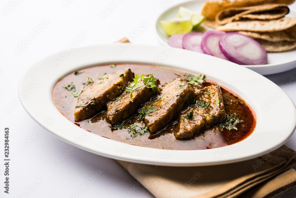 Patodi Rassa Bhaji or patwadi Sabji, a popular Maharashtrian spicy recipe served with Chapati and salad. Selective focus Patodi Rassa Bhaji or patwadi Sabji, a popular Maharashtrian spicy recipe served with Chapati and salad. Selective focus