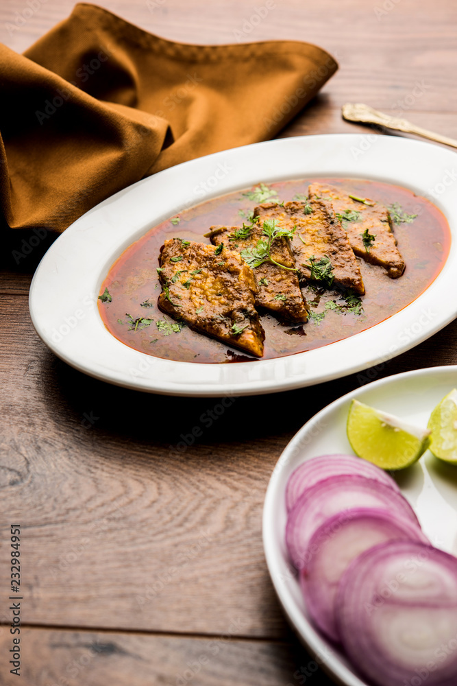 Patodi Rassa Bhaji or patwadi Sabji, a popular Maharashtrian spicy recipe served with Chapati and salad. Selective focus Patodi Rassa Bhaji or patwadi Sabji, a popular Maharashtrian spicy recipe served with Chapati and salad. Selective focus