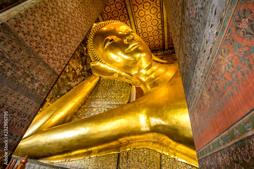 Buddha Reclining at wat pho in thailand photo