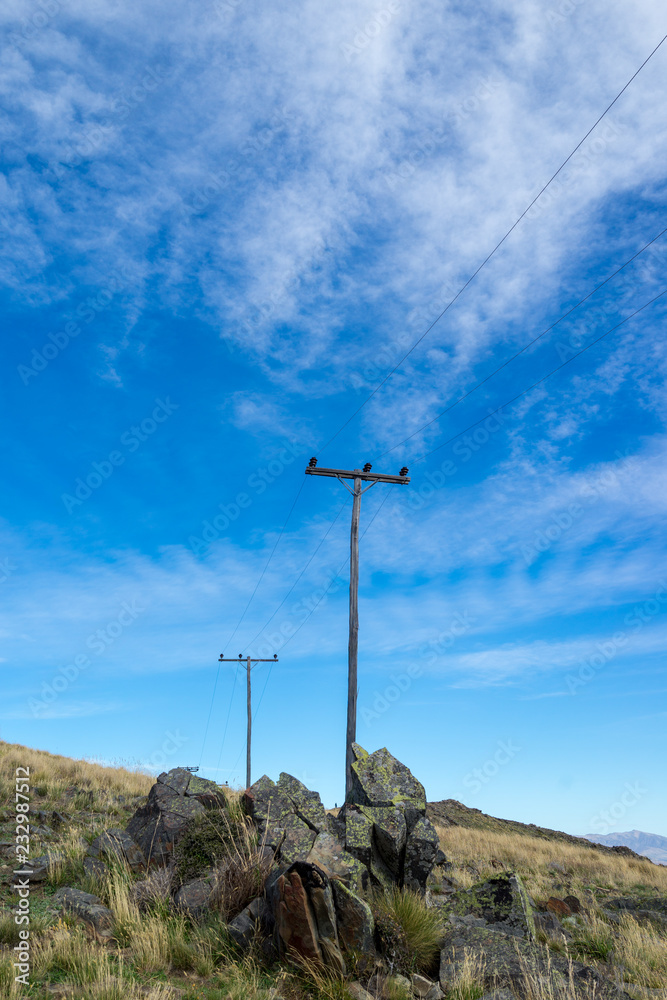 Electricity mast with powerlines in mountains