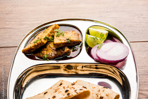 Patodi Rassa Bhaji or patwadi Sabji, a popular Maharashtrian spicy recipe served with Chapati and salad. Selective focus photo