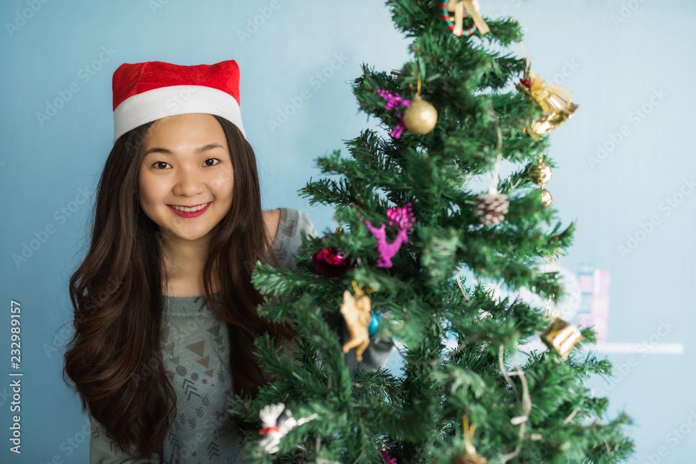 happy Asian Chinese girl at Christrmas tree