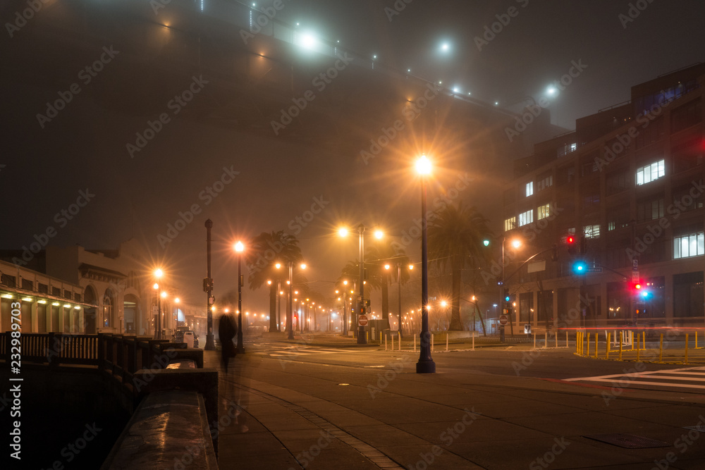 traffic in the city at a foggy night