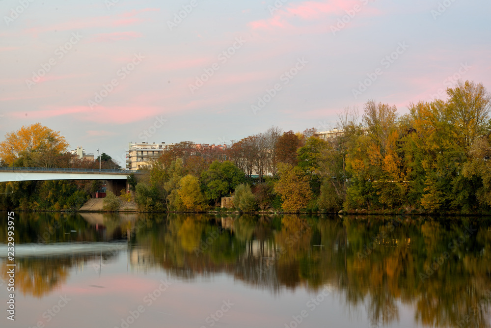 Sunset on the river Seine in autumn