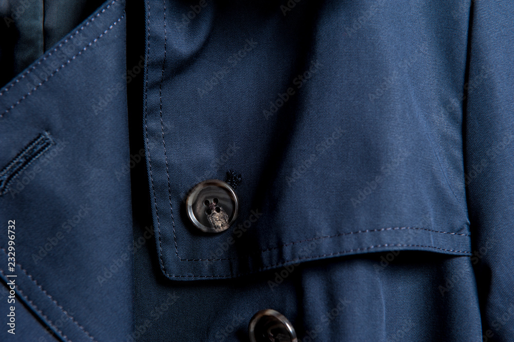 Partial close-up of buttons in dark clothes Partial close-up of buttons in dark clothes