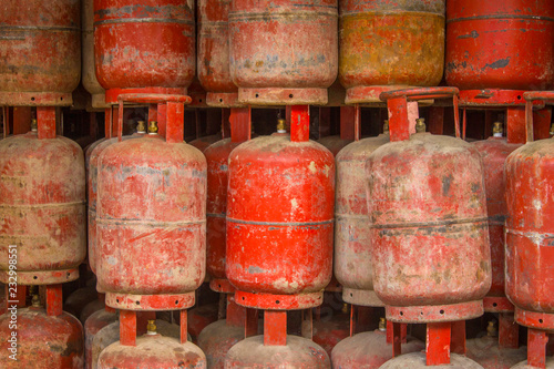 old red shabby gas cylinders in storage