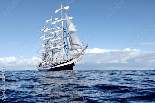 Sailing ship under white sails at the regatta photo
