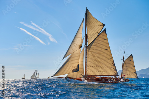 Sailboat under white sails at the regatta. Sailing yacht race © Alvov