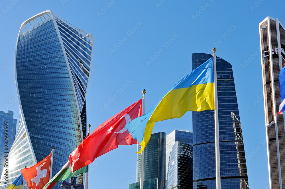 Flags of Ukraine and Turkey against of Moscow City skyscrapers