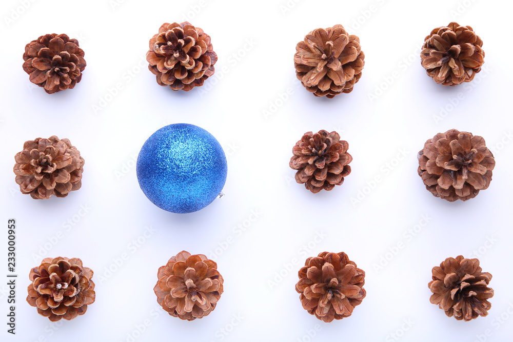 Christmas composition with pine cones and blue christmas ball on white background Christmas composition with pine cones and blue christmas ball on white background