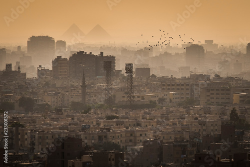 Cityscape of Cairo, with the Great Pyramids of Gizeh in the Background