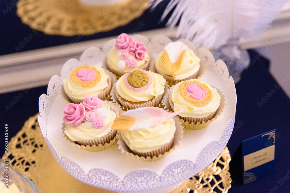 Elegant cupcakes on the wedding sweet table
