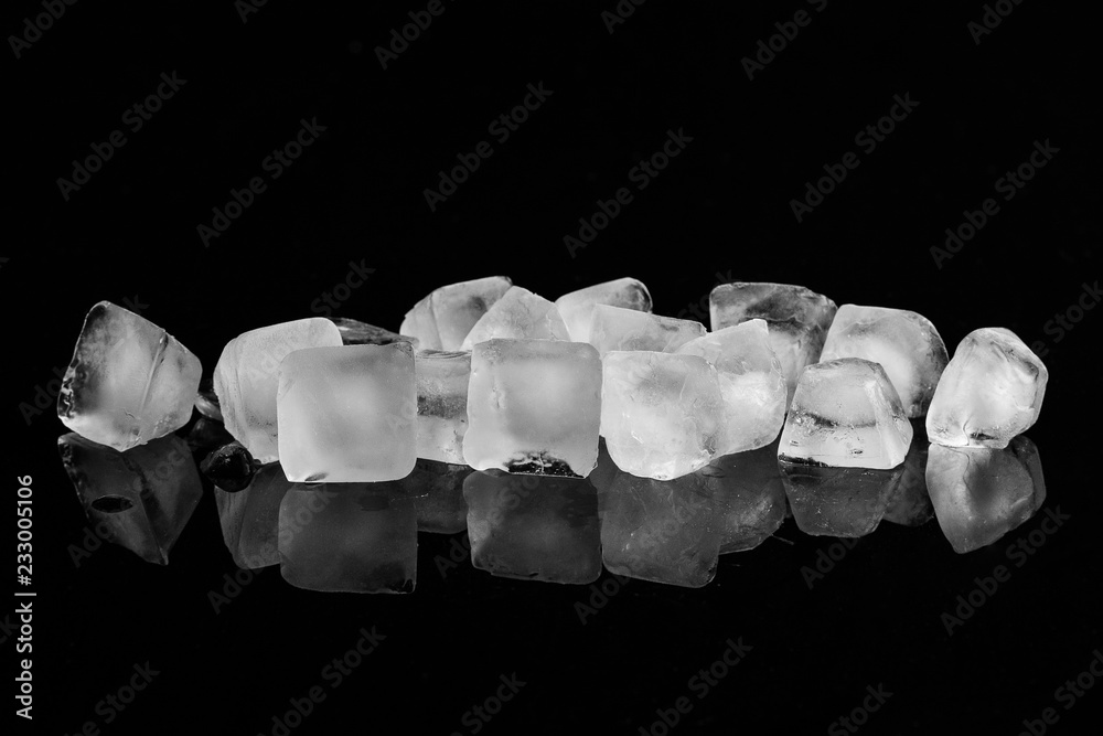 Ice cubes isolated on black background.