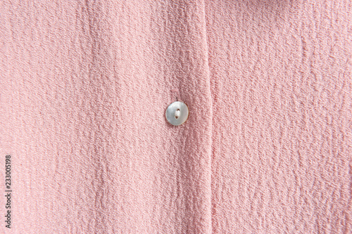Button detail of pink clothes