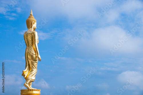 Golden Buddha statue standing at Wat Phra That Khao Noi, Nan Province, Thailand