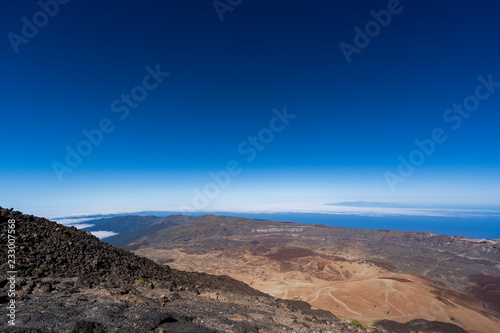 Hikers overlook the volcano's crater at Altavista Refuge, near the summit of Mount Teide