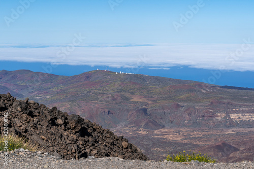 Hikers overlook the volcano's crater at Altavista Refuge, near the summit of Mount Teide