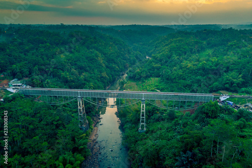 Scenic Aerial View of Cirahong Bridge, A Double Deck Structure of Metal Railway Bridge and Car Bridge Underneath Made by Dutch Colonial, Manonjaya Tasikmalaya, West Java Indonesia, Asia photo