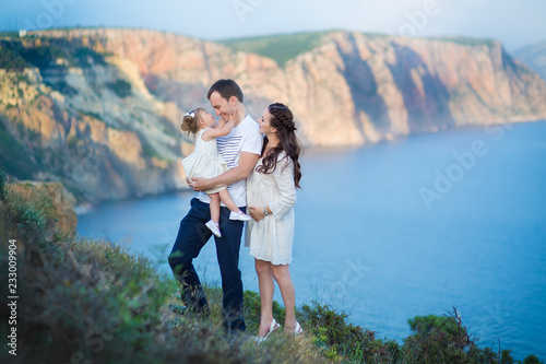 Couple family traveling together on cliff edge man and woman lifestyle concept summer vacations outdoor Crimean mountain top