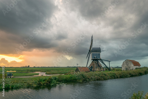 Classic dutch windmill in the wide open countryside near Leiden, Holland