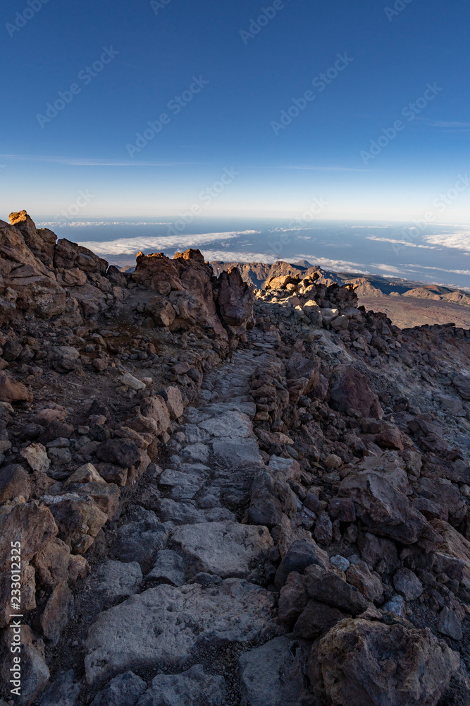 hikers reach the summit of Teide Mountain and enjoy the views from 3718 above sea level, Teide National Park, Tenerife, Canary Islands, Spain hikers reach the summit of Teide Mountain and enjoy the views from 3718 above sea level, Teide National Park, Tenerife, Canary Islands, Spain