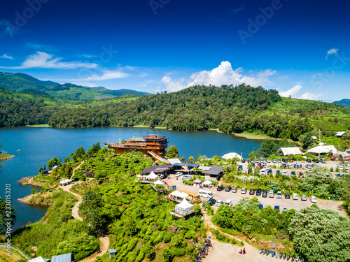 Aerial View of a Pinisi Boat Shaped Restaurant Building in the Edge of a Cape of Lake Patenggang, Ciwidey, Bandung, West Java, Indonesia, Asia photo