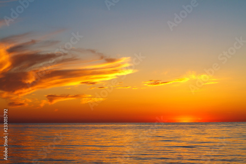 beautiful sunset clouds in the sky over the sea  bright colors of sunset