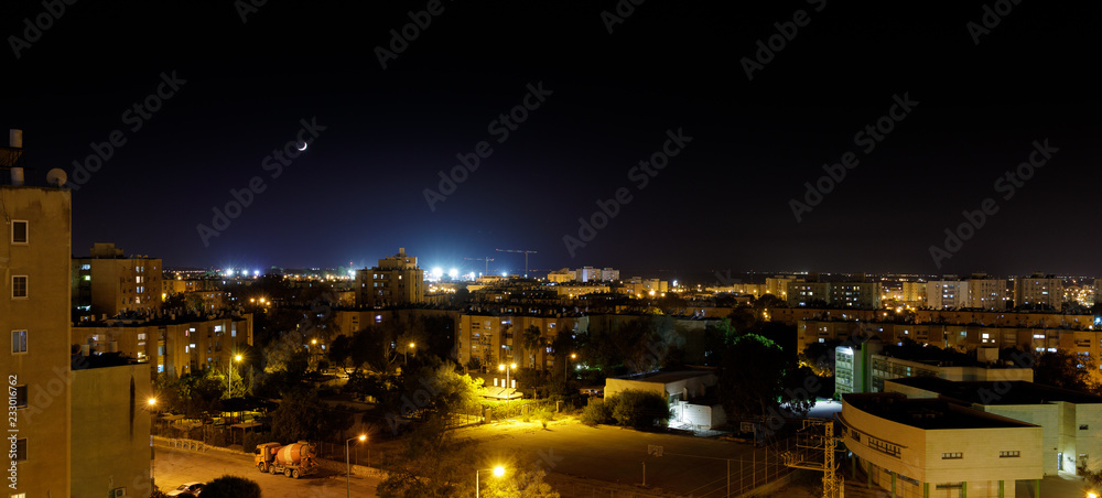 Fototapeta premium Panorama of city neighborhood at evening with new moon