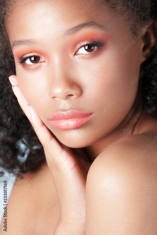 Young beautiful black girl with clean perfect skin close-up Young beautiful black girl with clean perfect skin close-up